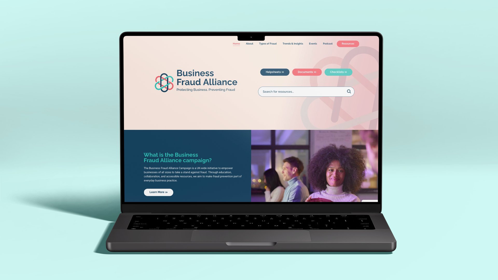 The Business Fraud Alliance campaign website shown on a laptop